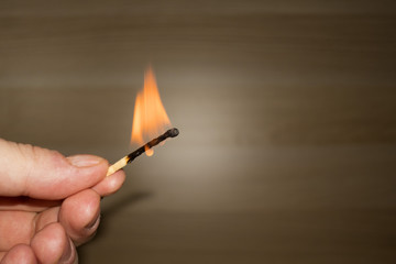 burned match in hand