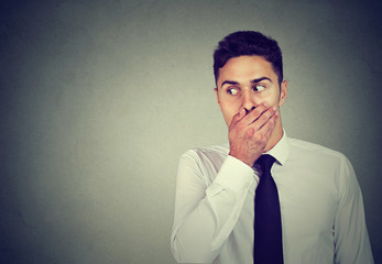 Funny looking curious businessman eavesdropping listing into private conversation