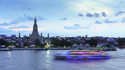 Wat Arun Ratchawararam Ratchawaramahawihan or  Wat Arun meaning Temple of Dawn on Chao Phraya River in twilight , Bangkok , Thailand