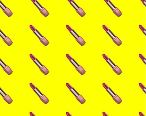 Seamless pattern with sketched lipsticks. Hand drawn makeup products. Red lipstick and yellow.