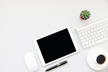 Modern Desk business working place with keyboard computer,Pen and tablet on table workspace top view with space for your text.