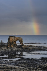 Fototapeta premium Looking North Towards a Rainbow Over Blyth's New Wind Turbines