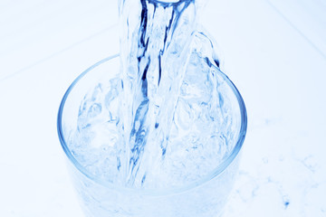 pour water into a glass