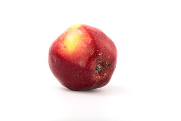 a large red ripe apple on white. Studio.