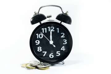 alarm clock  with coins for display planning money financial and business