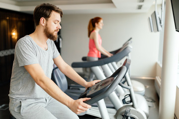 Obraz premium Sportive male exercising on bicycle