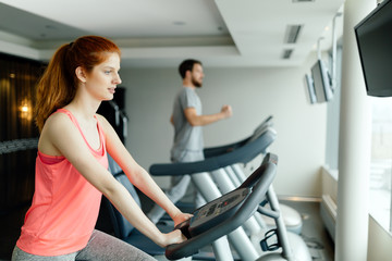 Fototapeta na wymiar People cardio workout in gym