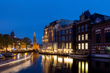 Fototapeta na wymiar Night city view of Amsterdam, the Netherlands with Amstel river.