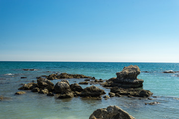 rocks in shallow sea near the coast