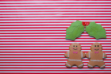Christmas cookies on stripe background top view. Various types christmas gingerbread cookies flat lay. Christmas characters cookies. Christmas cookies background