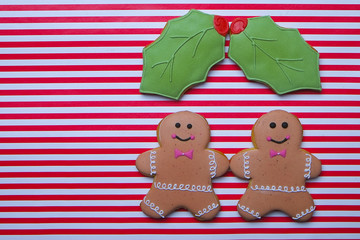 Christmas cookies on stripe background top view. Various types christmas gingerbread cookies flat lay. Christmas characters cookies. Christmas cookies background