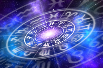 Zodiac signs inside of horoscope circle on universe background