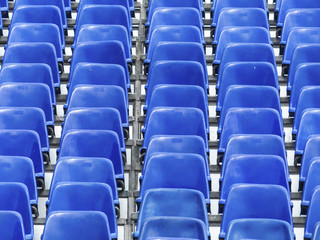 tribune with blue chairs