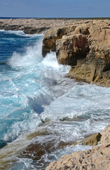 Waves breaking on rocks at Cape Lara Paphos Cyprus