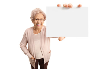 Senior lady showing a blank card