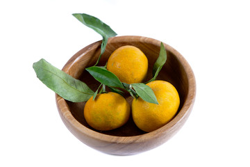 Tangerines in a bowl on white background
