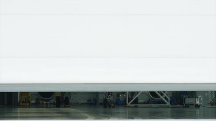 Gates open aircraft hangar is located inside a passenger plane. Gate of the aircraft hangar