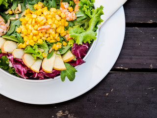 Artistic bowl of fresh corn and seafood salad