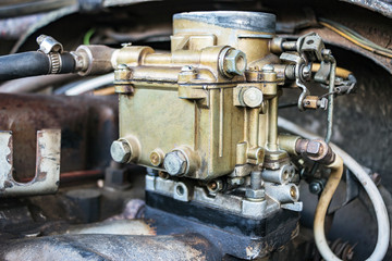 Old carburetor on an Vintage car engine