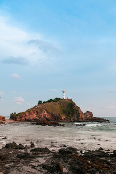 Lighthouse and rock beach at Laem Tanod Cape Koh Lanta, Krabi, Thailand