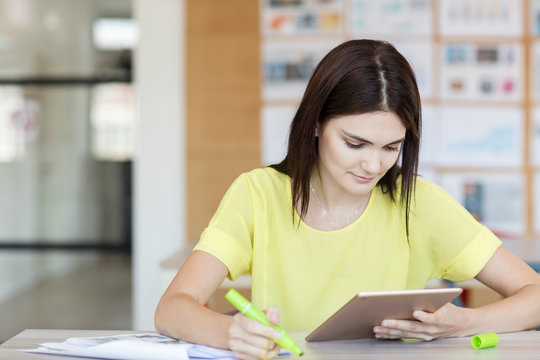 Student working using digital tablet in class