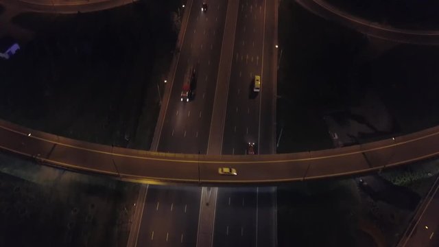Aerial: Traffic on flyover of Moscow beltway and night cityscape