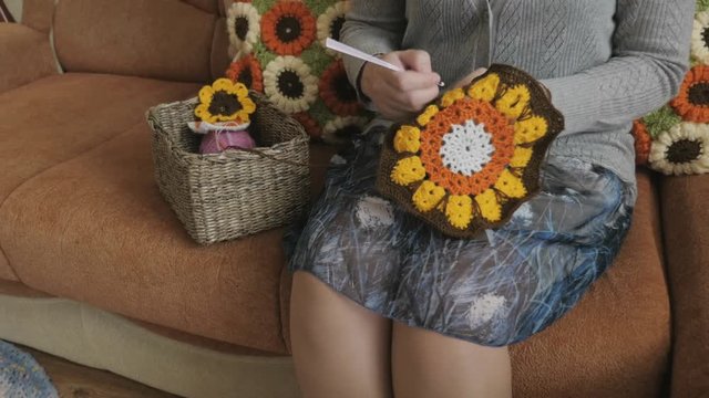 Woman knits crochet. Ability to crochet.
