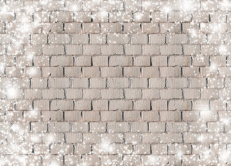Christmas background in vintage style with snow and snowflakes on brick wall