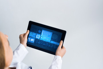 Close of female doctor hands working with tablet pc computer