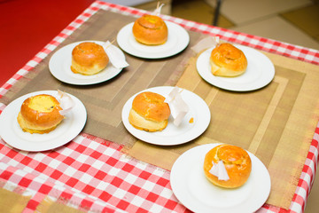 children prepare a stuffed bun of raw ingredients