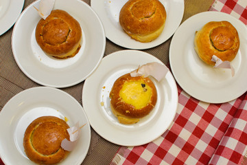 children prepare a stuffed bun of raw ingredients