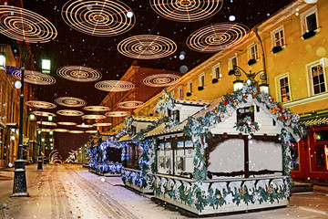 Christmas market on the streets of Moscow  at snowy night
