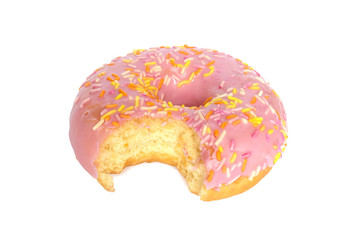one bite missing of donut with pink frosting and colorful sugar sprinkles isolated on white background