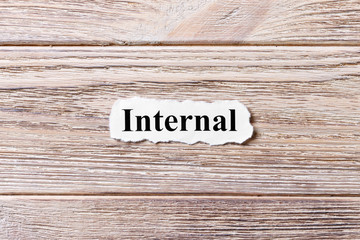 Internal of the word on paper. concept. Words of Internal on a wooden background