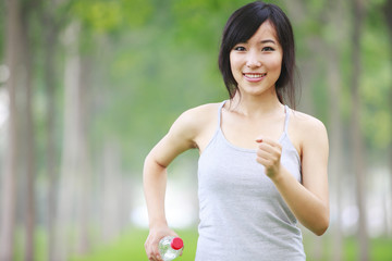 Fototapeta premium one pretty young asian woman doing morning exercise in the park