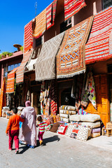 colorful carpets hanging at moroccan shops, marrakech