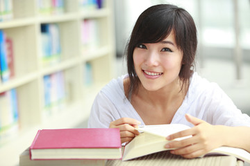 pretty asian college student in library