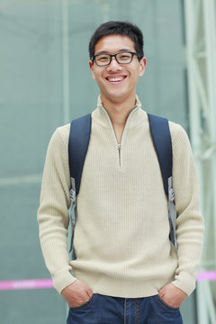 picture of one young asian male college student in campus