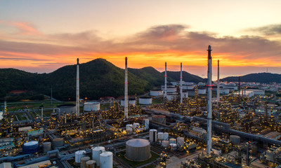 Aerial view Oil refinery.Industrial view at oil refinery plant form industry zone with sunrise and cloudy sky.Oil refinery and Petrochemical plant at dusk,Thailand. Oil refinery background sunset
