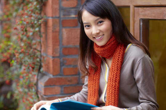 one  pretty asian college student study in the campus