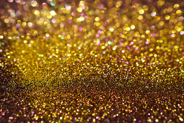 colorful abstract golden and brown bokeh light glitter background for Christmas and New Year's day