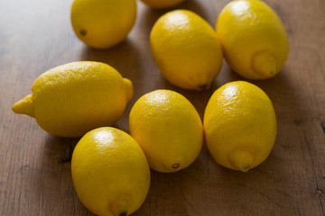 lemons on wooden surface
