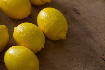 lemons on wooden surface
