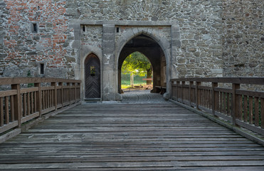 Fototapeta na wymiar Castle with gothic gate and wooden bridge, Helfstyn, Czech Republic