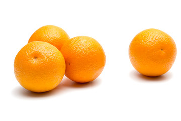 four oranges on white
