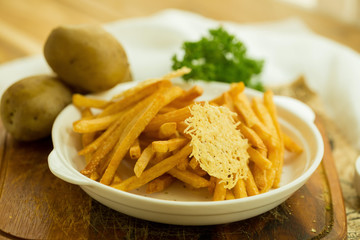 Extra Crispy Oven Baked French Fries and mozzarella cheese topping. isolated on white background