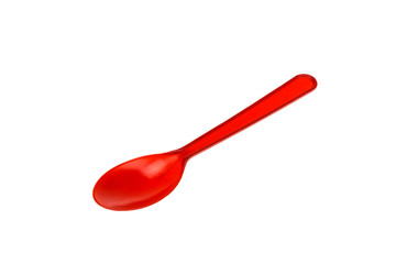 a red spoon made of plastic