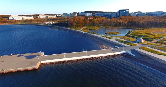 Modern university in the Russian Far East. Russian Far Eastern Federal University campus and bay with pier. Near the Vladivostok. Aerial view.