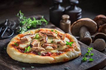 Enjoy your rustic pizza made of wild mushrooms and herbs