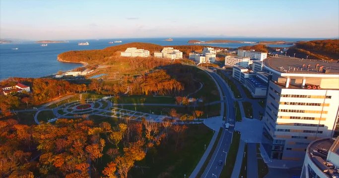 Modern university in the Russian Far East. Russian Far Eastern Federal University campus, park and bay with pier. Near the Vladivostok. Aerial view.